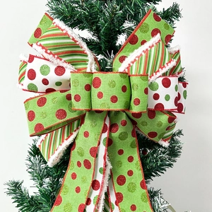 Christmas bow tree topper with red green white polka dots and fuzzy snow trim edge
