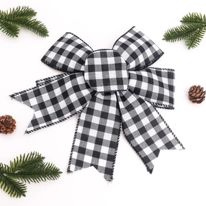 Detail of buffalo plaid bow with wired edges for Christmas wreaths and gifts