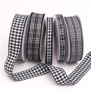 Classic black and white houndstooth and striped ribbon rolls for DIY gift wrapping