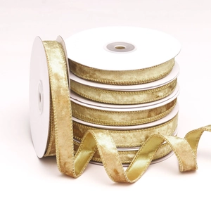 Golden velvet ribbon with metallic edges on rolls for DIY Christmas craft decoration