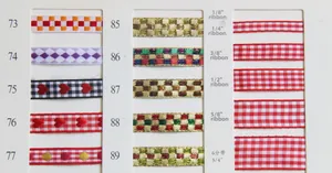 Close-up of assorted plaid ribbons and patterned weaving straps in various widths