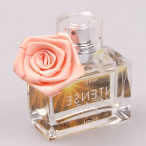 Pink satin rose ribbon on clear 30ml glass perfume bottle with silver spray nozzle