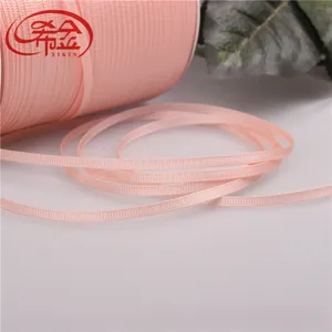 Detailed view of 3mm pink grosgrain ribbon roll for elegant gift packaging and DIY crafts