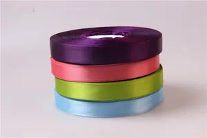 Detailed macro view of 2cm colorful satin ribbons in purple, pink, green, and blue