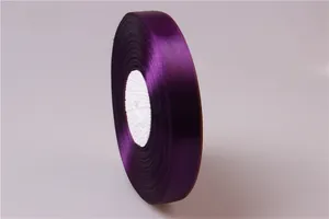 Detail of 2cm purple satin ribbon roll with silk finish for gift and cake packaging