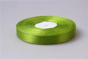 Detail of 2cm grass green satin ribbon roll with smooth polyester surface for gift wrapping
