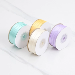 Set of four pastel polyester satin ribbons for DIY gift wrapping and flower decoration