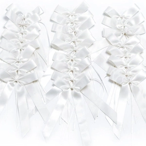 Elegant white satin ribbon bows for wedding decor and gift wrapping accessories