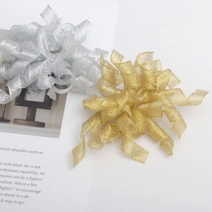 Metallic gold and silver spiral ribbon bows for Valentine and Christmas gift packaging