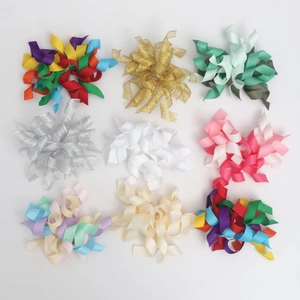 Top view of nine colorful corkscrew grosgrain ribbon hair bows in 3x3 grid layout