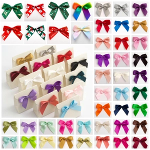 Polyester satin ribbon bows in assorted solid colors and Christmas patterns for DIY crafts