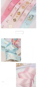Detailed view of pink and blue polyester ribbons with gold princess crown prints