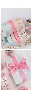 Close-up of assorted gold-foiled satin ribbons with crown patterns for gift wrapping