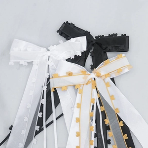Elegant organza ribbon bows with gold heart lace edges for gift wrapping or hair accessories