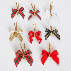 Detailed collection of eight festive Christmas bows with golden bells and twist ties