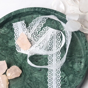 3cm white hollow floral lace ribbon for DIY crafts and gift wrapping on marble tray