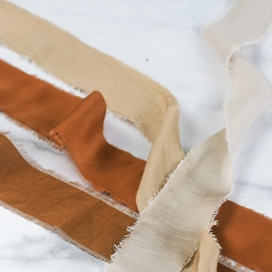 Handmade frayed edge cotton silk ribbons in warm earth tones for wedding bouquets and DIY