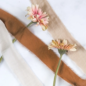 Close-up of handmade raw edge cotton silk ribbons for wedding bouquets and DIY crafts
