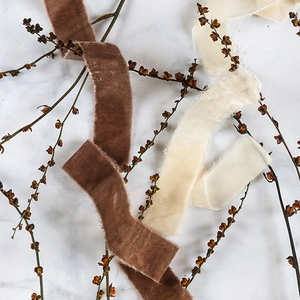 Velvet ribbons with frayed edges in dark coffee and cream white for gift packaging