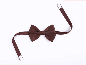 Detailed view of brown polyester bow tie with adjustable strap and white velcro closure