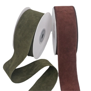 Olive green and burgundy velvet ribbons on spools for DIY bows and garment accessories
