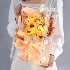 Close-up of elegant snow gauze ribbon with printed text on a flower gift box