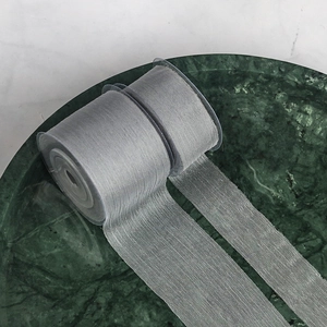 Detail of 4cm grey chiffon ribbon on spool, ideal for wedding bouquet and gift wrapping