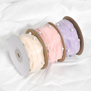 Rolls of sheer pleated ribbon with white pearls in cream pink and lilac for DIY
