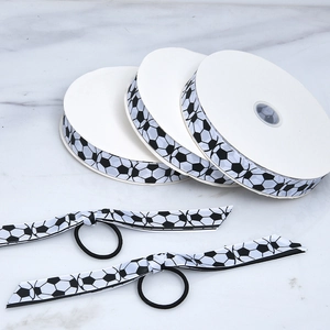 Detailed view of soccer print polyester ribbons and matching elastic hair ties set