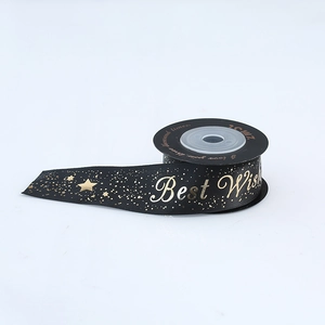 Detail of 1.5cm black satin ribbon with gold foil stars and Best Wishes lettering