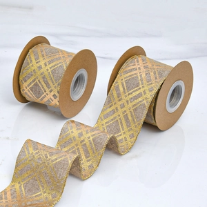 Close-up of faux linen ribbon with gold glitter grid pattern and wired edges
