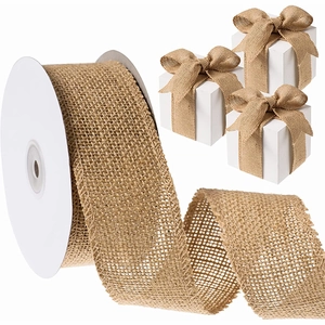 Detail of natural burlap ribbon roll with reinforced edges and decorative gift box bow
