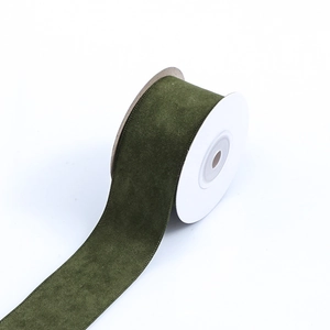 Deep dark green velvet ribbon roll with elegant side stitching for DIY crafts and decor