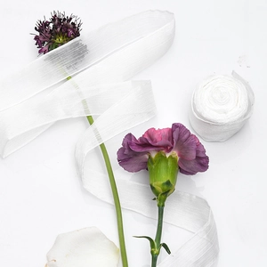 White semi-transparent silk chiffon ribbon for wedding invitations and flower bouquets