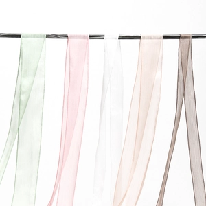 Close-up of multicolored translucent chiffon silk ribbons hanging for wedding decor
