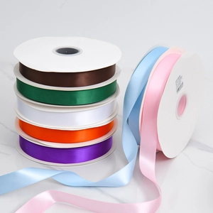 Rolls of premium double-sided satin ribbon in multiple colors for elegant gift packaging