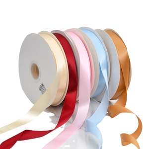 Multiple colors of 2cm double-sided satin ribbons on reels for gift wrapping