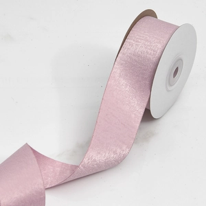 Close-up of light pink velvet ribbon roll with satin sheen for gift box DIY bows