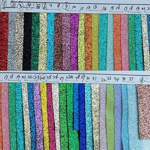 Detailed color chart showing 38 shades of glitter ribbons with sparkling texture