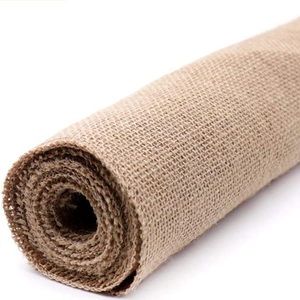 Natural light brown jute fabric roll with visible plant fiber texture for decor