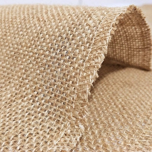 Natural jute fabric roll with cross-weave texture and durable hemmed edges for table runner
