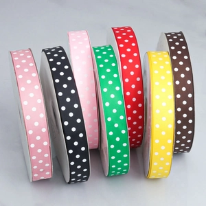 Close-up of colorful 2.5cm grosgrain ribbons with white polka dots for DIY hair bows