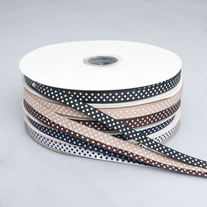 Polka dot grosgrain ribbons in black, beige, and navy for DIY hair bow crafting