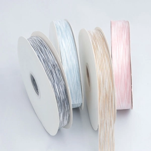 Polyester striped ribbons in four soft colors for gift wrapping and DIY crafts