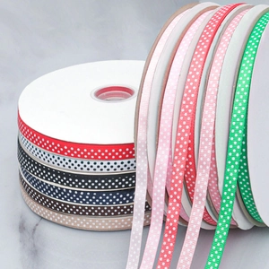 Macro detail of multi-colored polka dot grosgrain ribbons for DIY craft hair bows