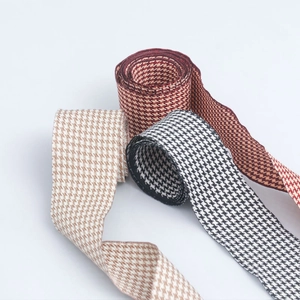 Detailed texture of 4cm houndstooth ribbons in burgundy, brown and black for DIY crafts