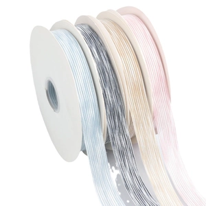 Striped polyester ribbon rolls in four colors for gift wrapping and DIY crafts