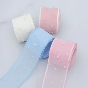 Detail of 4cm sheer ribbon with plush dots and white pearls for DIY gift wrapping