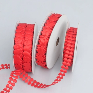Detail of red heart and star cutout polyester ribbons for wedding gift wrapping