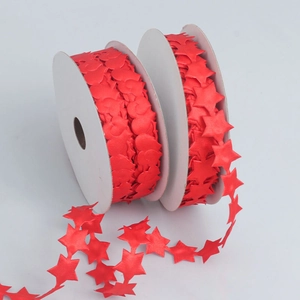Detail of red heart and star shaped polyester ribbons for wedding and gift packaging
